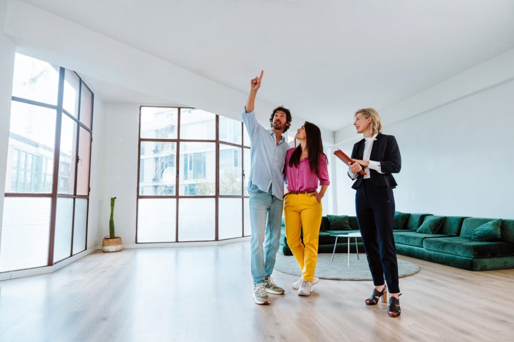 Real estate agent showing an apartment to a couple.